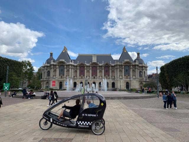 Taxi-bike tour in front of the Palais des Beaux-Arts